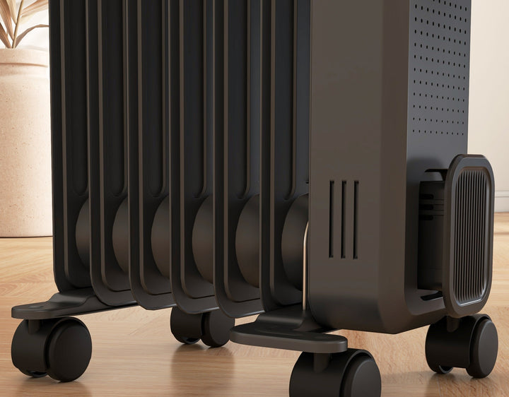 dark grey oil filled radiator with castor wheels