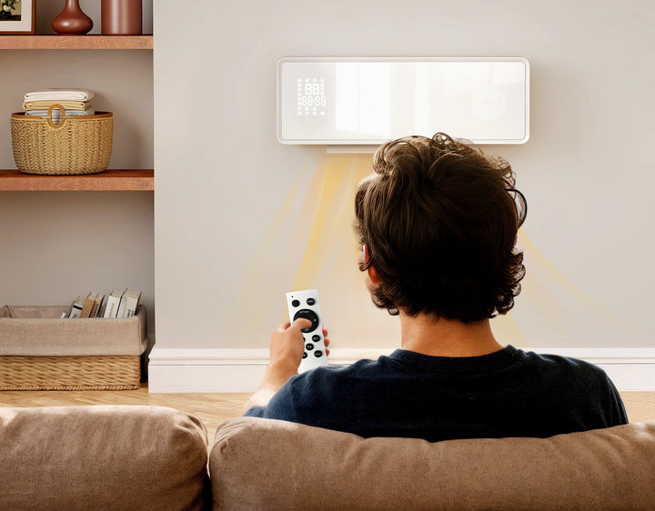 white wall-mounted ceramic fan heater with glass panel