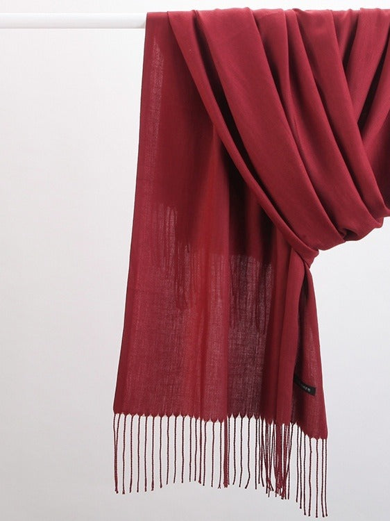 Woman in soft fringed scarf