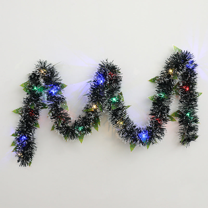 Tinsel Christmas garland with lights and Santas