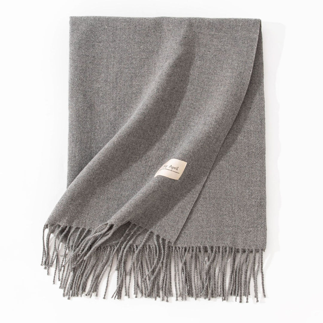 Woman wearing wide soft shawl scarf