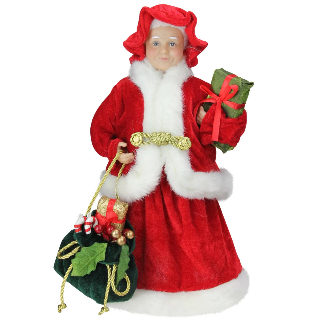 Mrs Claus figure carrying presents