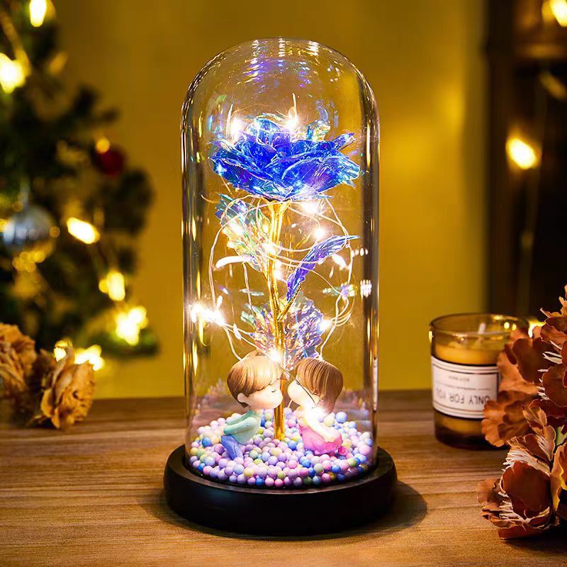 Red rose in glass dome with lights
