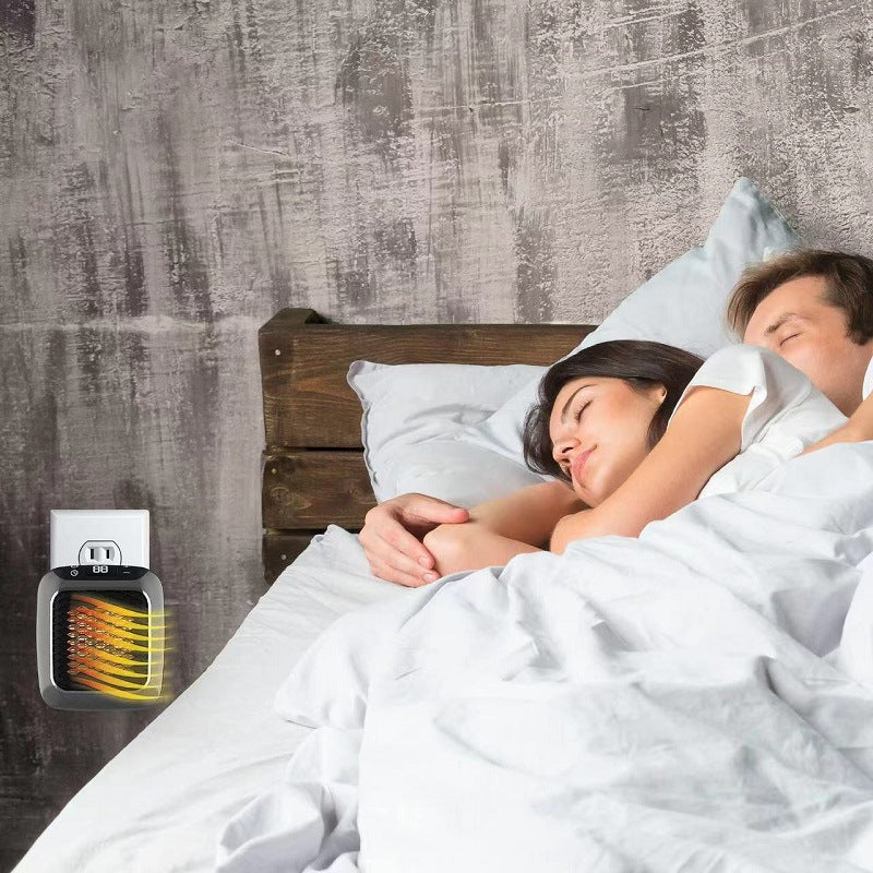 compact grey plug-in heater in a wall socket