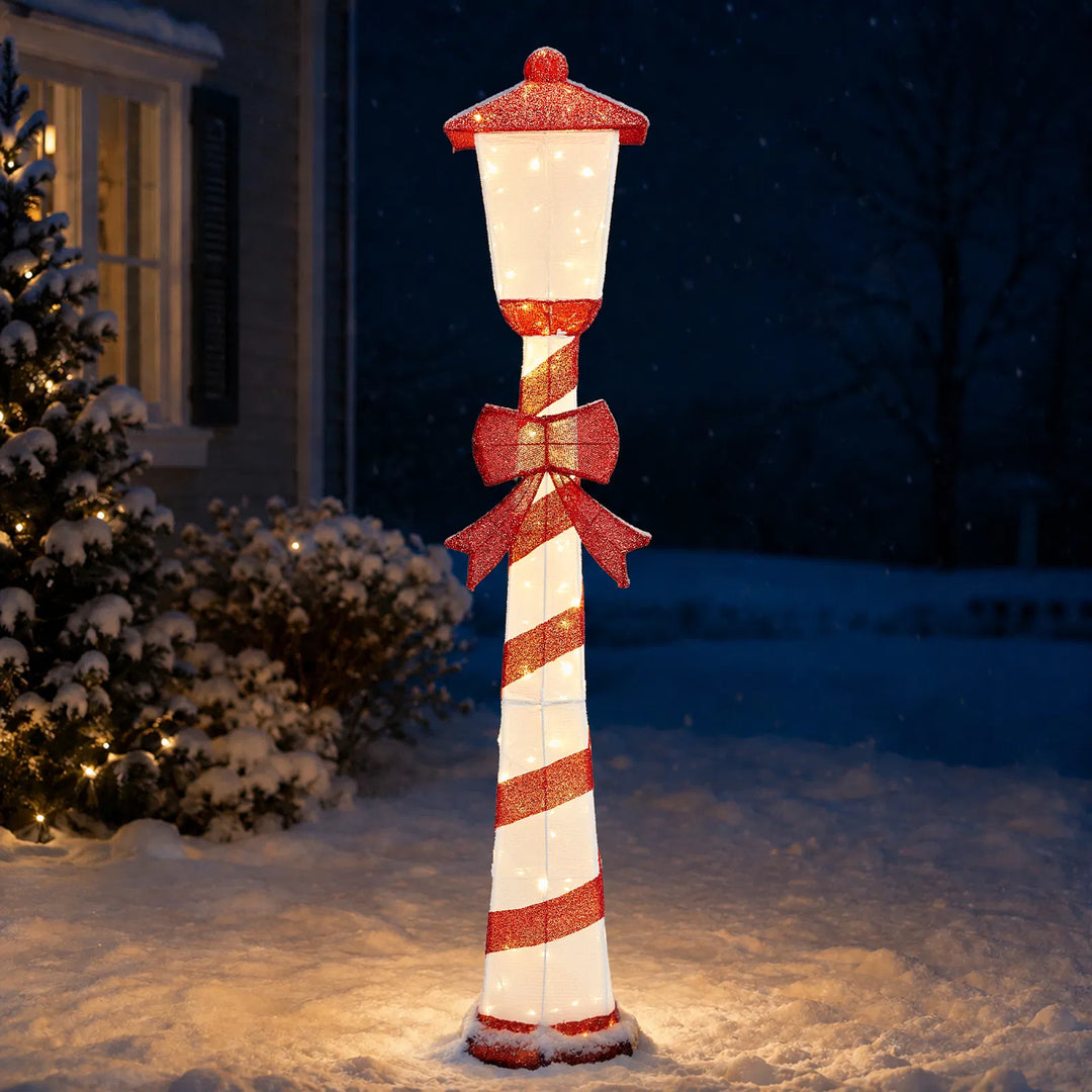 Candy cane striped Christmas lamp post glowing