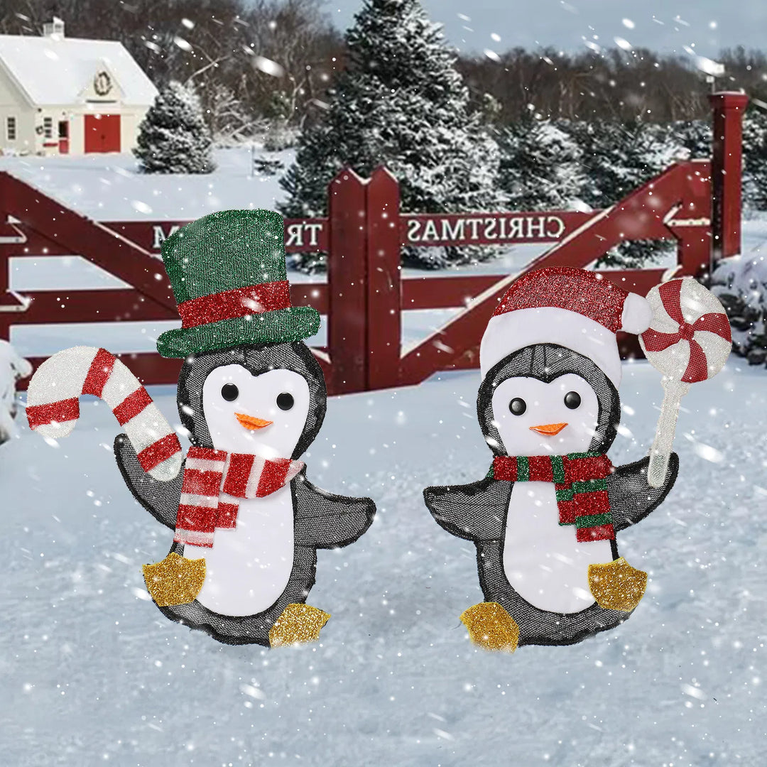 Two light-up Christmas penguins with candy canes