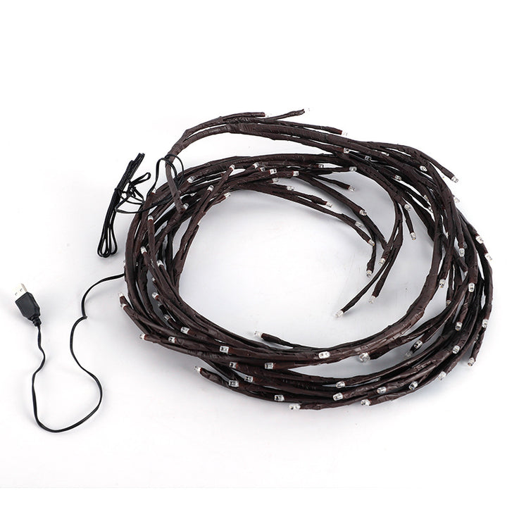 Warm white LED branch light on wall
