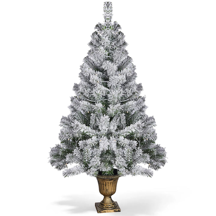 Small flocked tree in a decorative pot