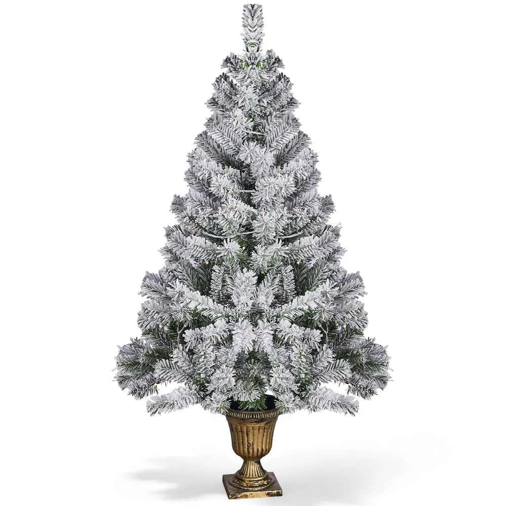 Small flocked tree in a decorative pot