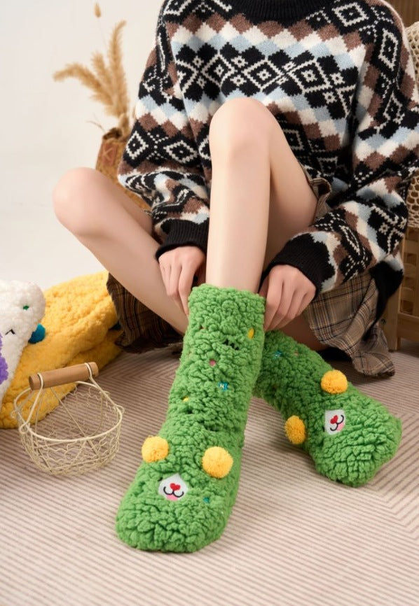 Fluffy yellow socks with embroidered face and pompoms