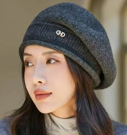 Off-white knitted beret with folded brim