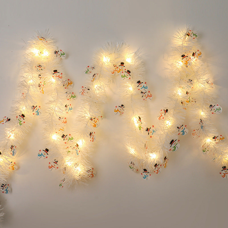 Tinsel Christmas garland with lights and Santas