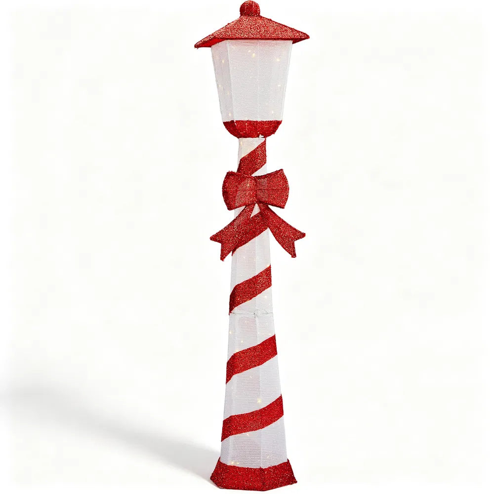 Candy cane striped Christmas lamp post glowing