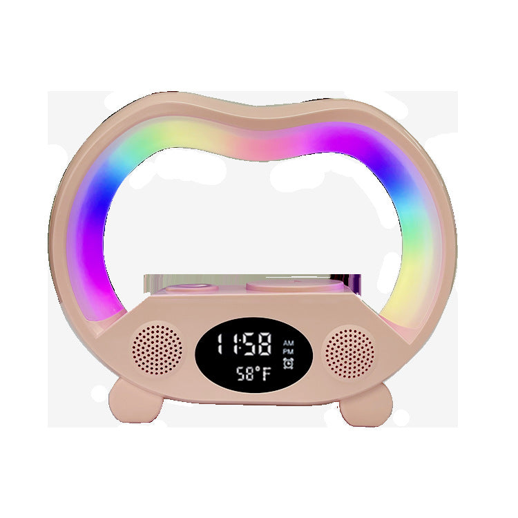 Lamp with speaker charging phone at bedside