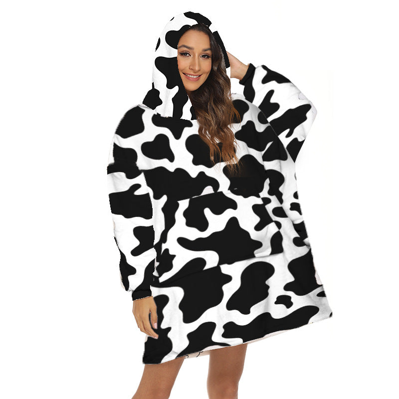 Person wearing oversized panda hooded blanket