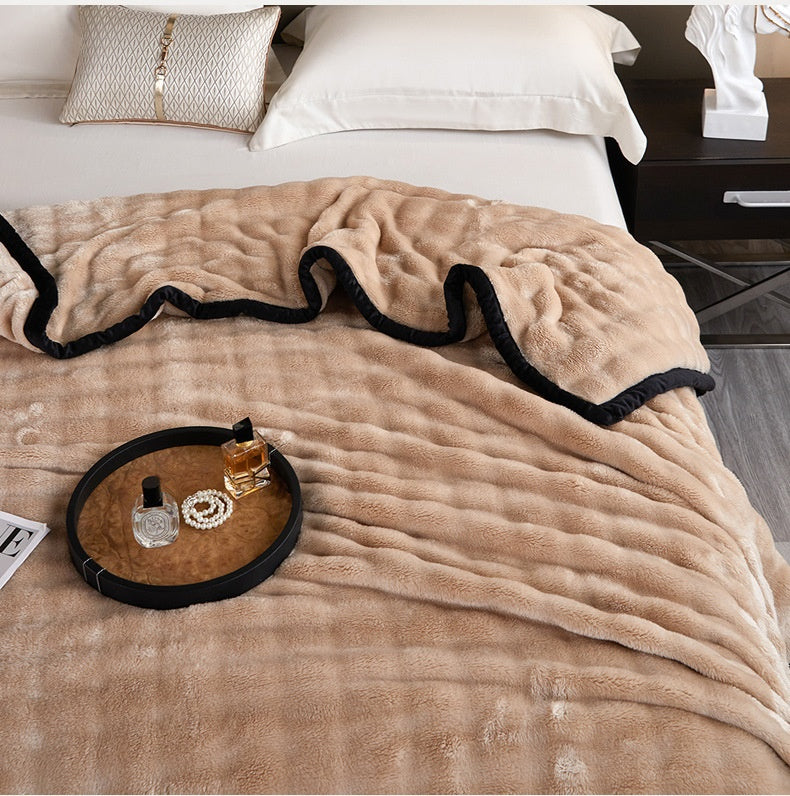 Sage green bubble fur blanket with black trim