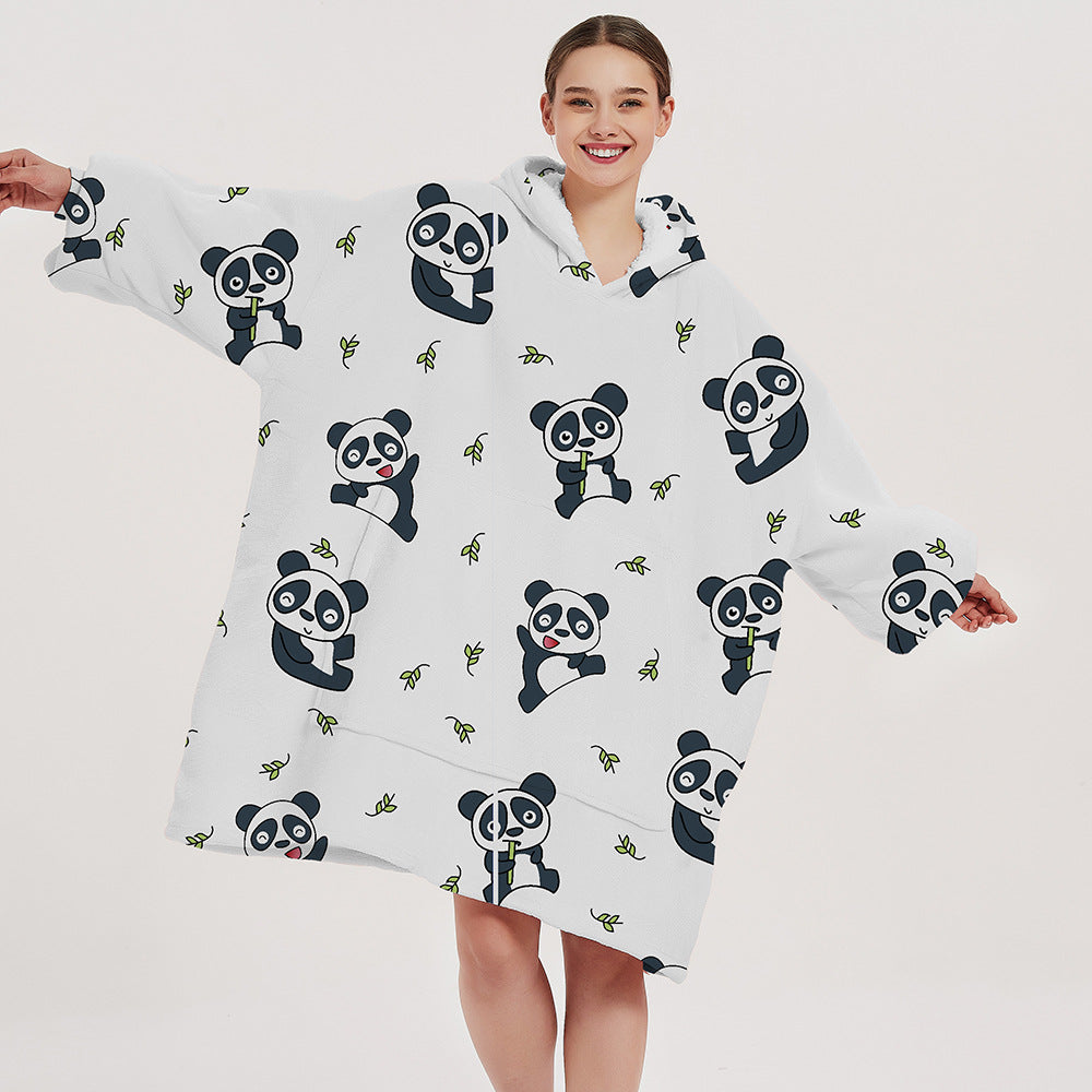 Person wearing oversized panda hooded blanket