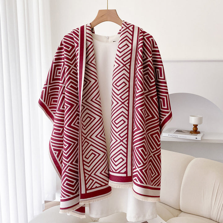Woman wearing grey fringed shawl cape