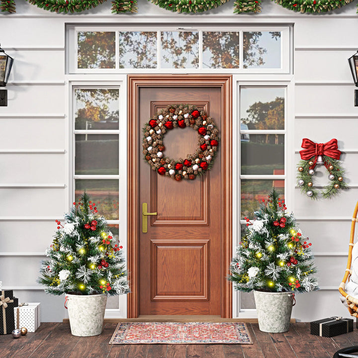Pair of decorated battery porch trees