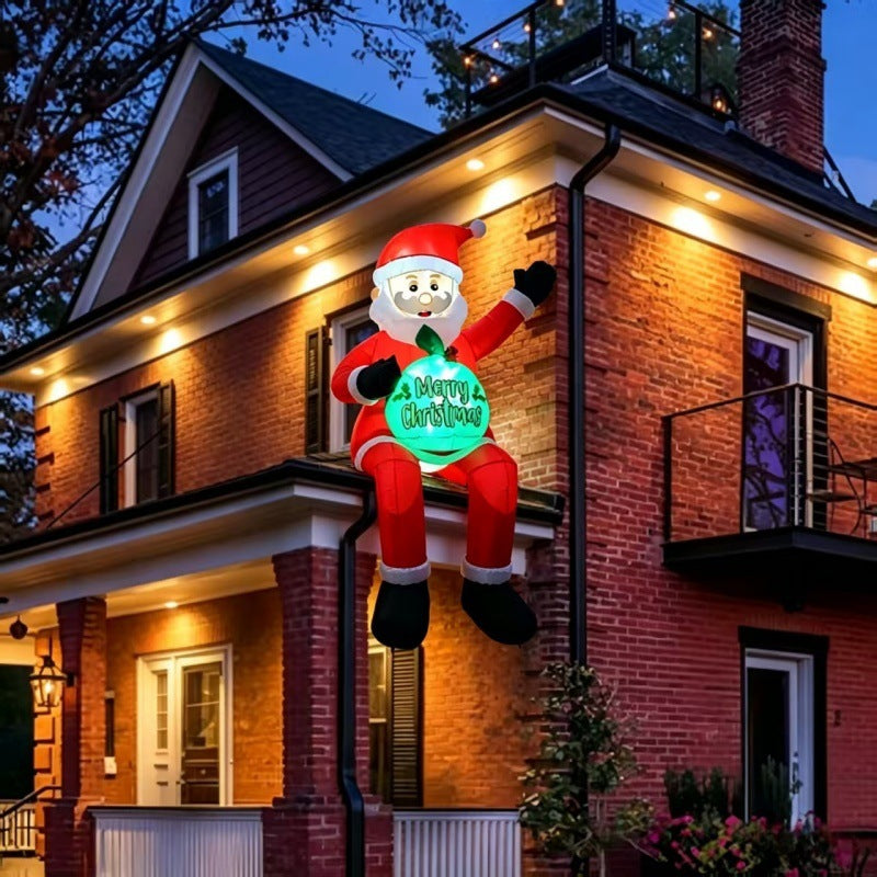 Giant inflatable Santa with gift sack in garden