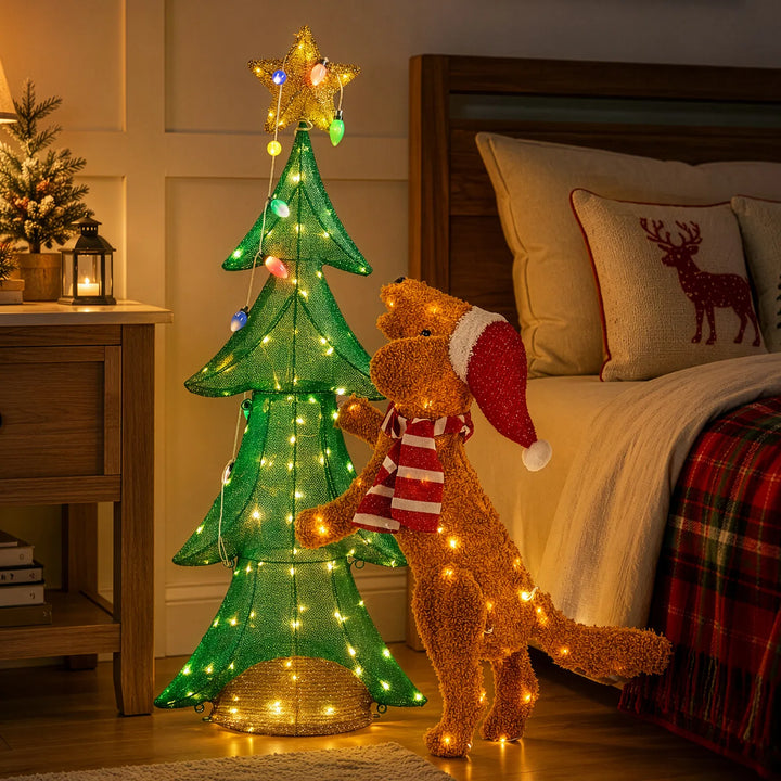 Plush dog climbing a lit Christmas tree