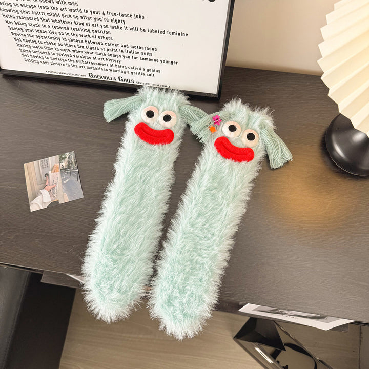 Fluffy socks with googly-eyed monster faces